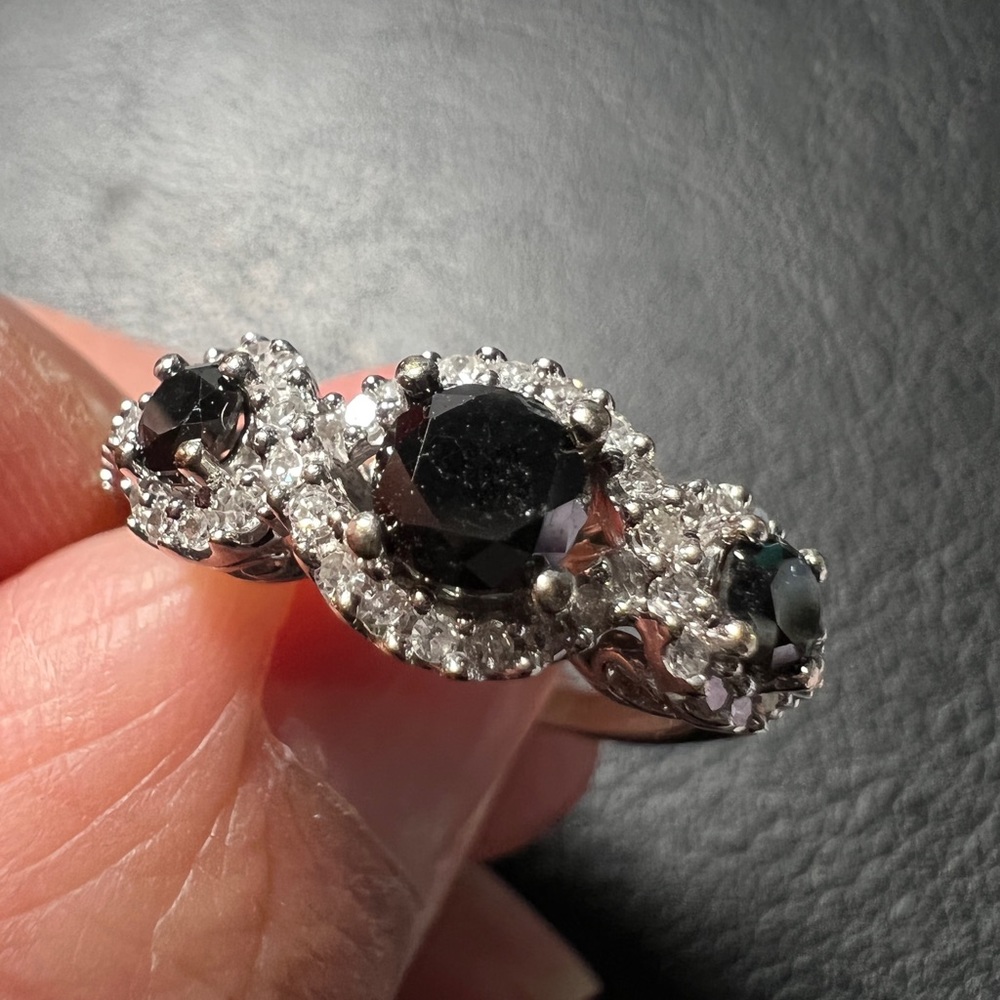 10-karat white gold Three round prong-set black diamonds ring